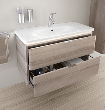 VitrA Nest washbasin unit with two open drawers showing toiletries